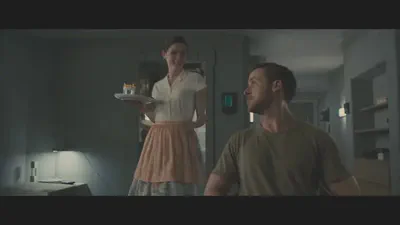 Joi emerges from the kitchen