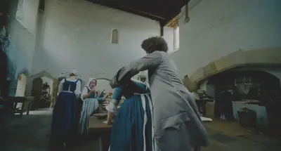 The wide lens is made more palpable with figures moving in the foreground